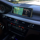 The “car in a green circle” button is actually the “intellegent safety” button. I have no idea what it does.